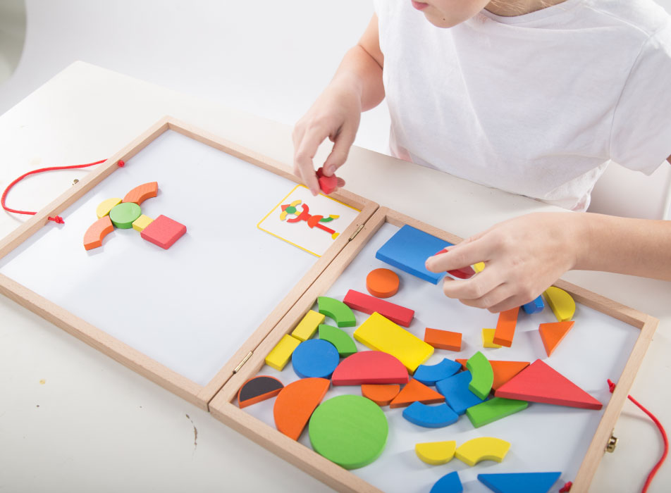 child-doing-puzzle Child working out a puzzle